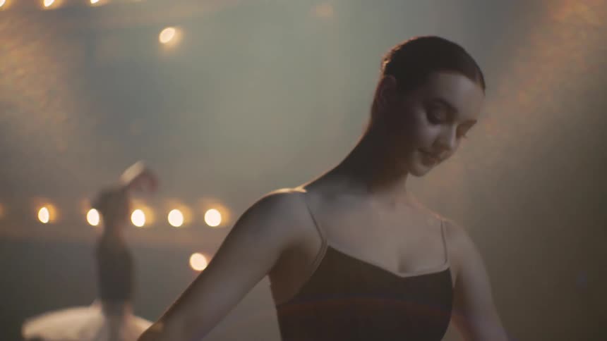Two women ballet dance on stage