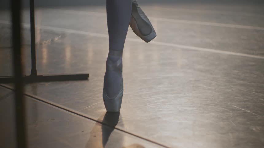 Close up of a ballerinas legs as she dances