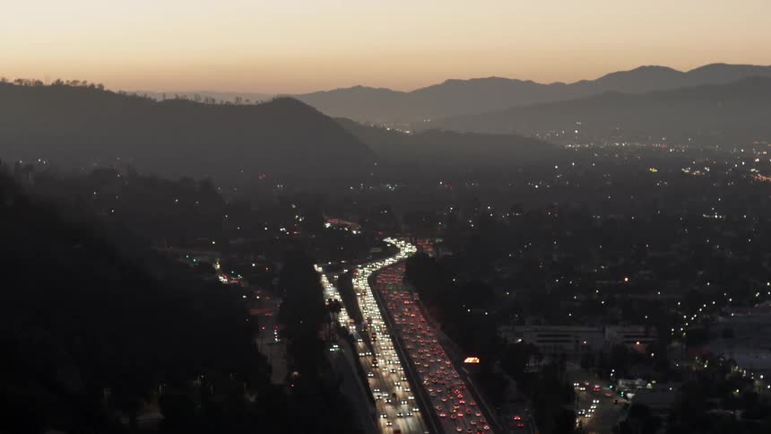 Aerial view of busy roads at sunset