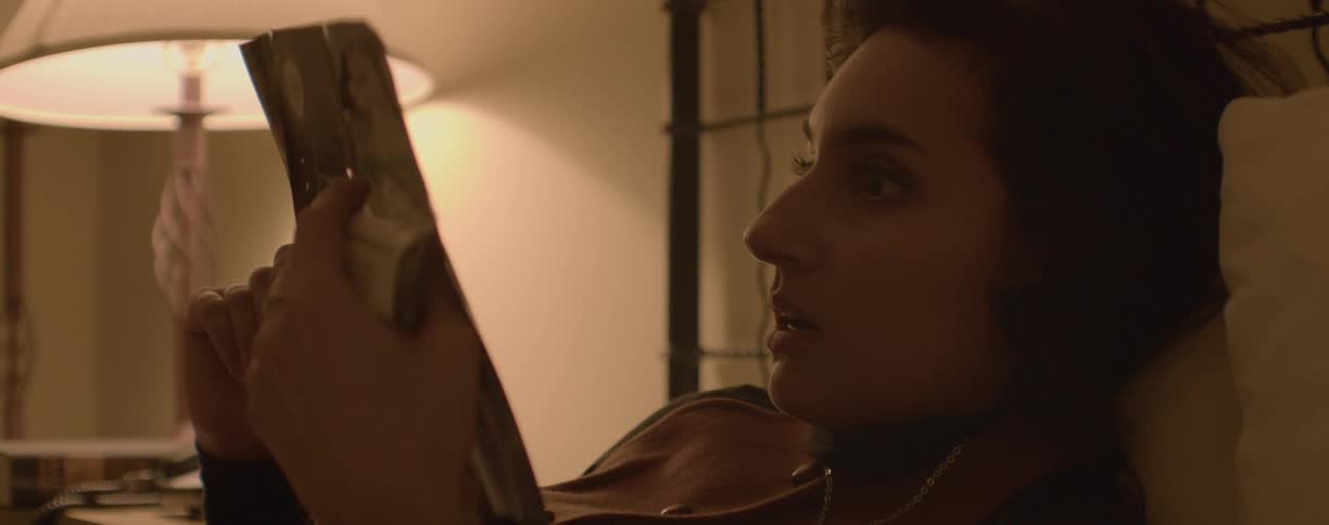 A woman is reading in bed