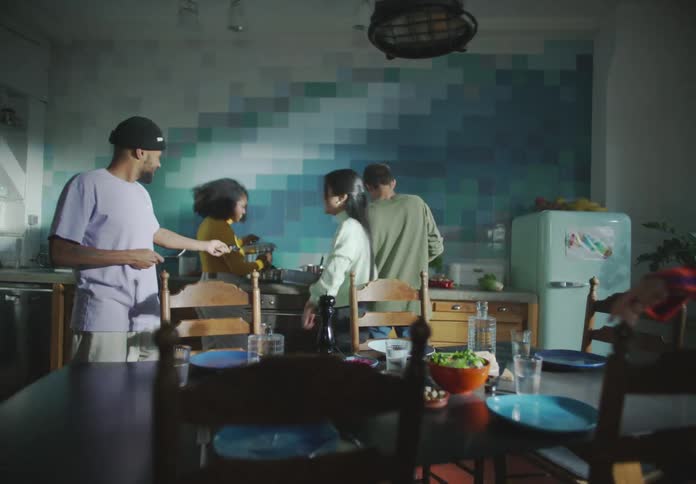 Friends work together to put a meal on the table