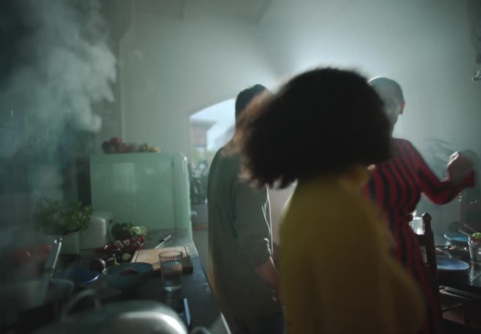 People are dancing and partying as they cook