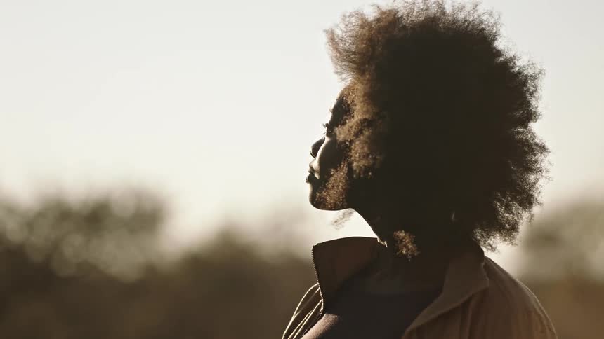 Black woman outside in the evening