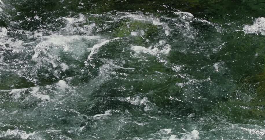 The water in the river is moving fast
