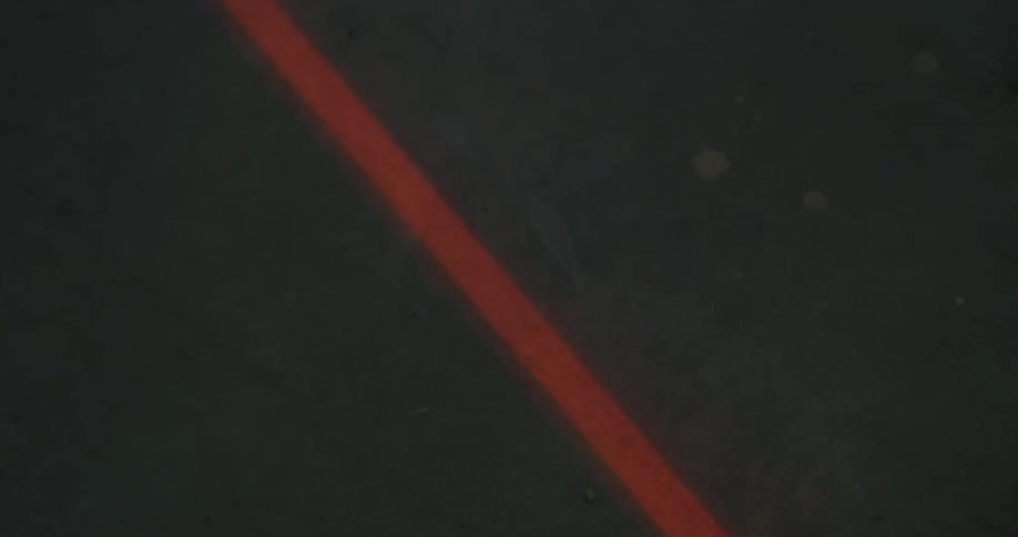 Mist swirling by a red line