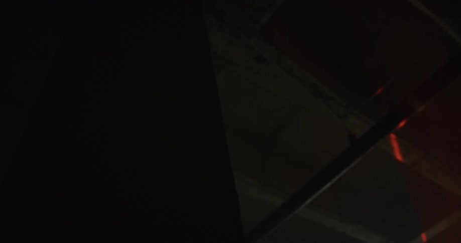 Laser beam sweeps along room crossing pipe hanging near ceiling