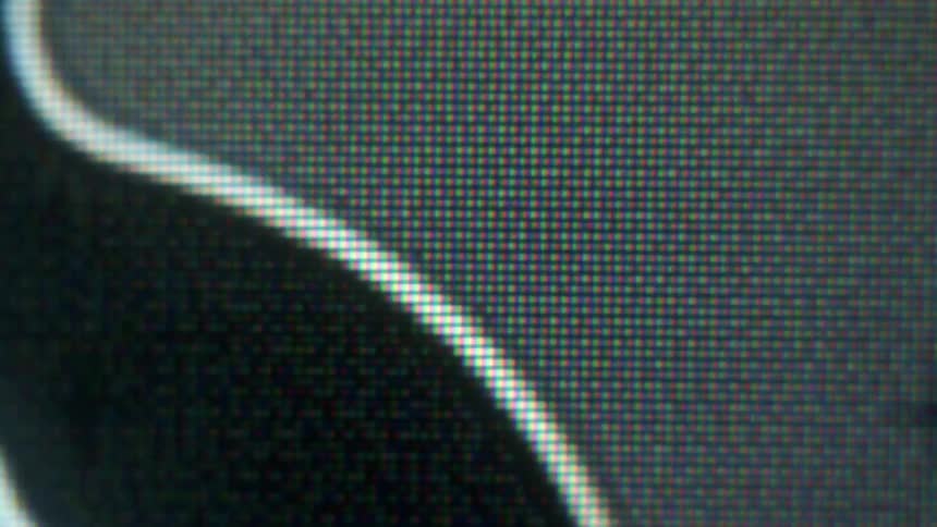 Close up of a fuzzy display with white lines moving