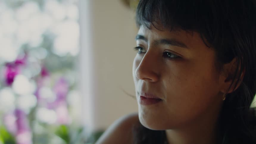 Woman stares as she thinks