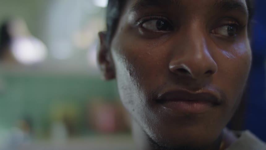 Closeup view of a womans face is displayed indoors