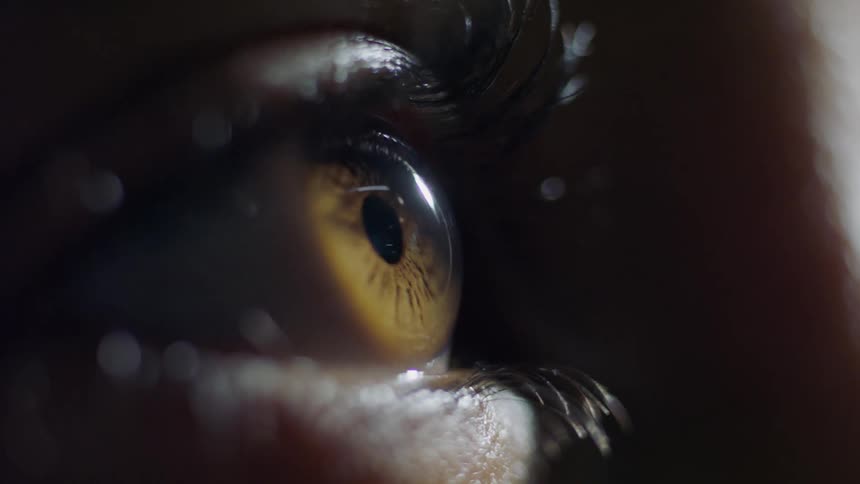 A person blinks their eye
