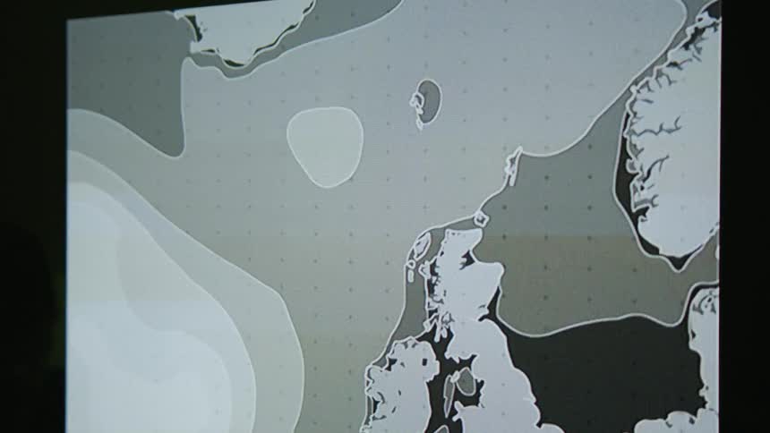 A display shows some coastlines with flashing white lights and lines