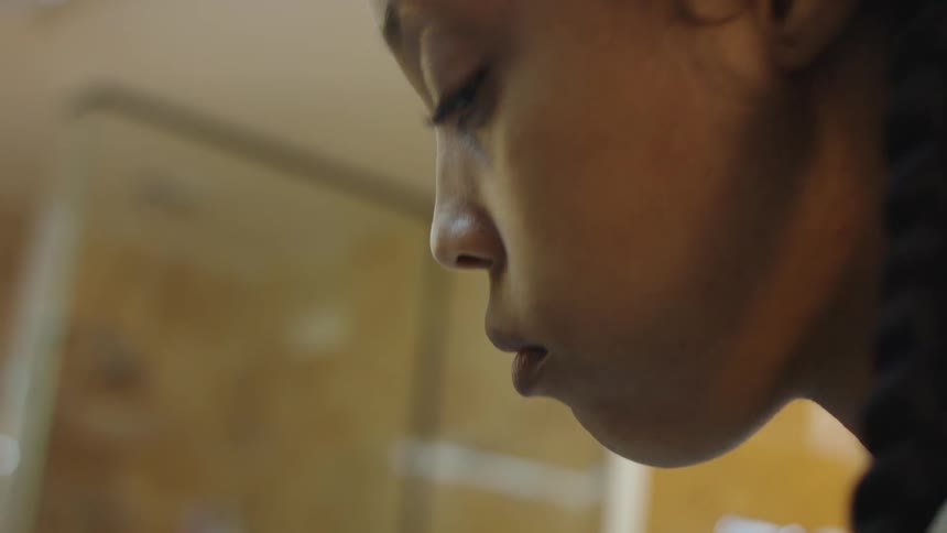 Closeup view of a womans face is displayed
