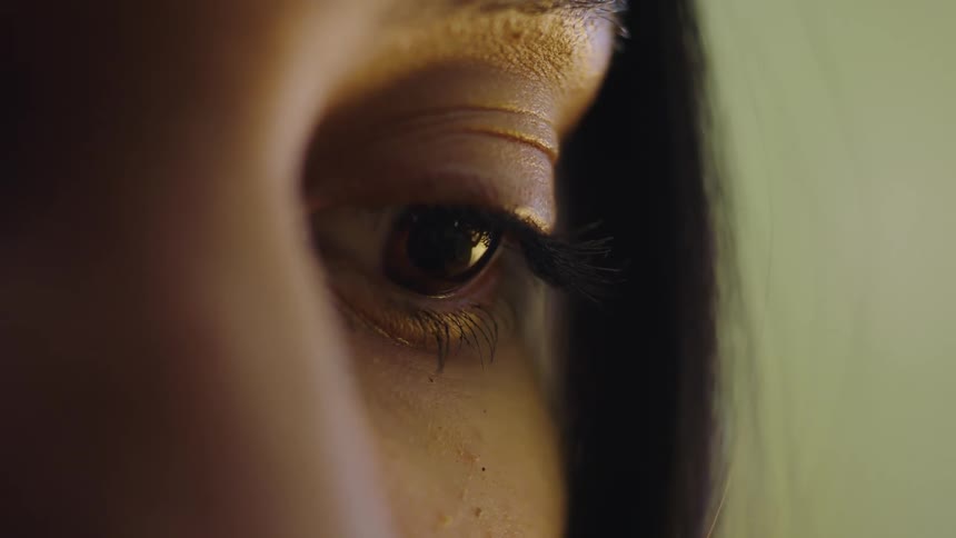 A woman looks sad as she stays mostly still