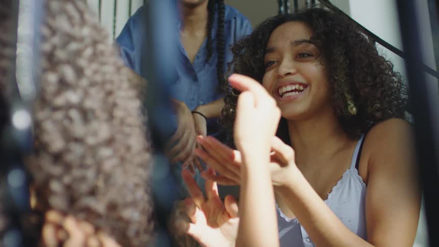 A group of friends are laughing together and having fun