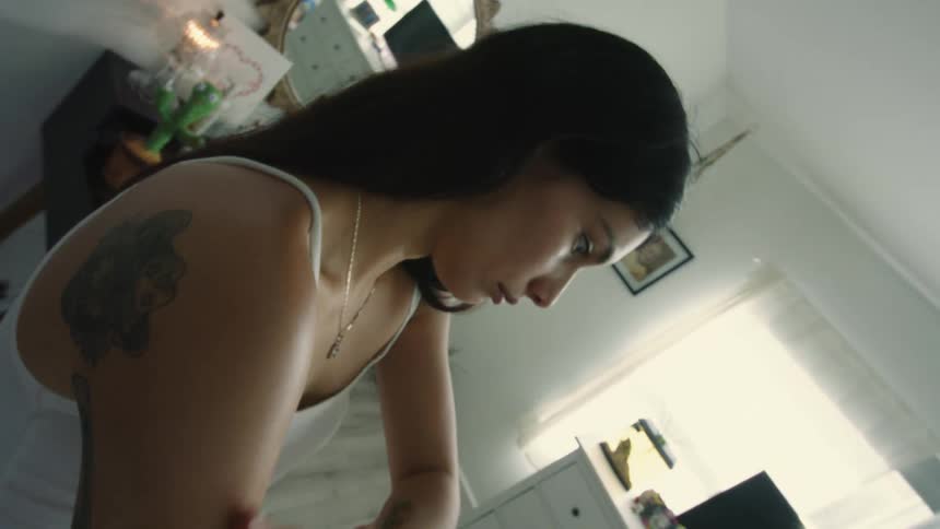 A woman wipes lotion on her arm