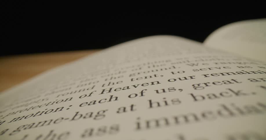 An open book with pages filled with text