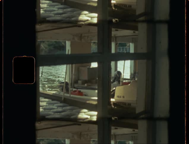 Footage from inside a boat as it travels on the water
