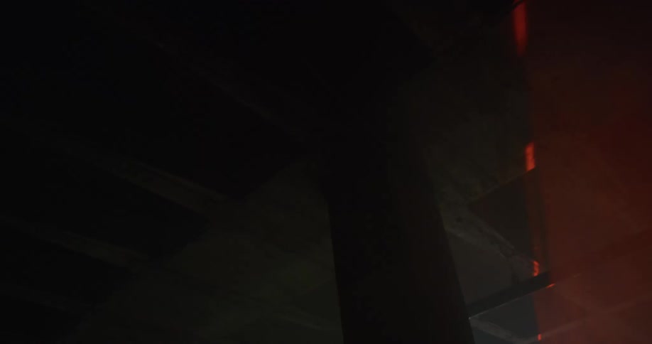 A red laser shining in a dark room