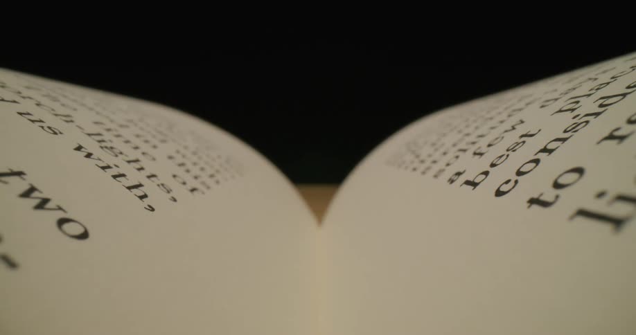 Book sits open on wooden surface