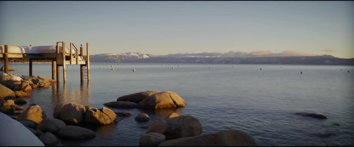 Time lapse of a lake at dusk as the sun rises