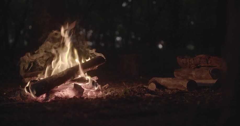 A fire burns at night