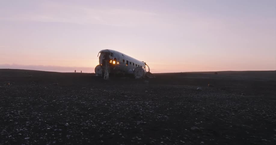 A broken down airplane is displayed on the beach