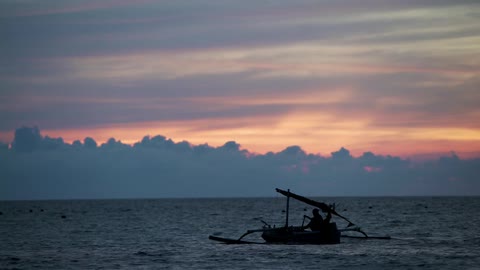 A boat sailing on the morning