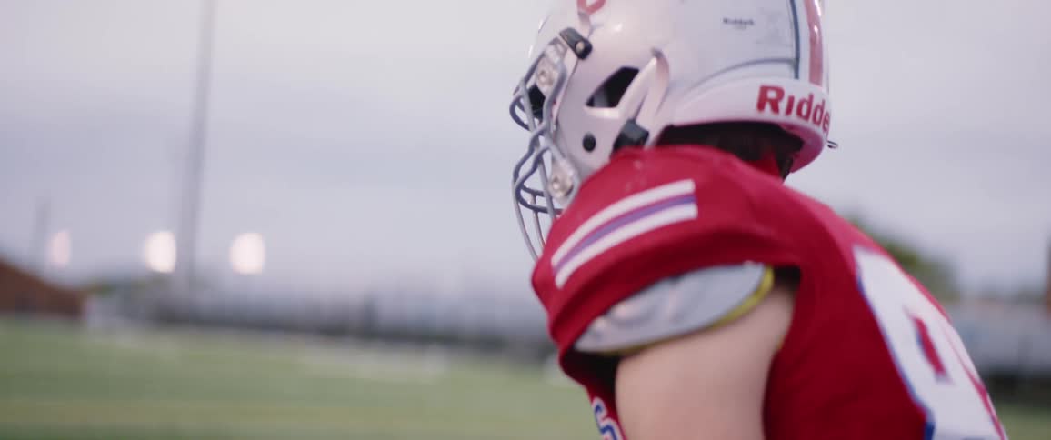 A football player standing up on a field