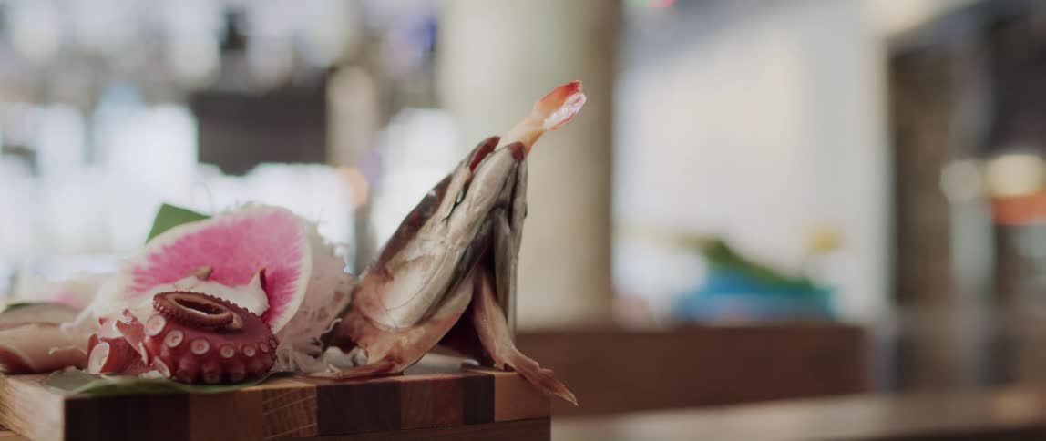A cut up octopus is sitting on a table
