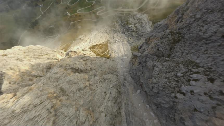 A view of a person flyng down a mountain