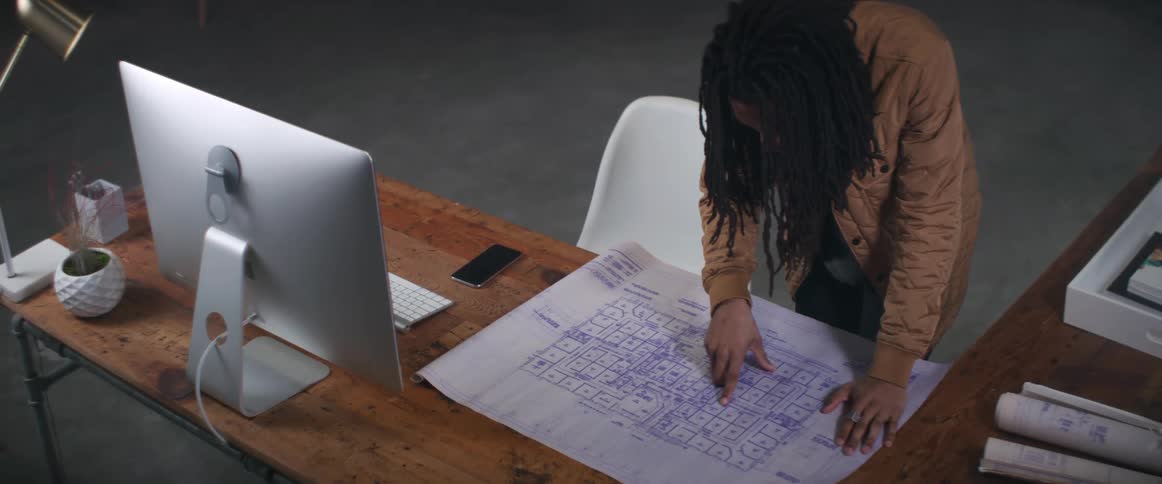 A person is looking at a diagram in their office