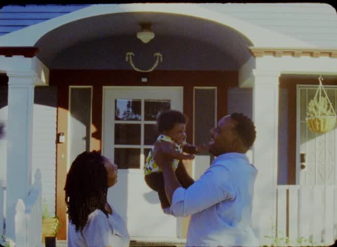 A father playing with his baby by throwing her into the air