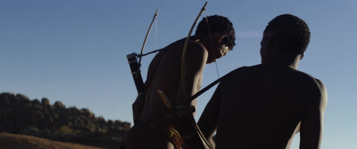 Tribal men with bows