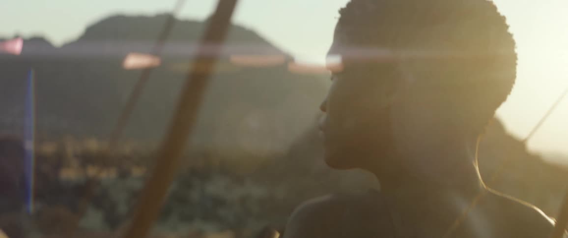 Primitive hunters shield their eyes from the sun