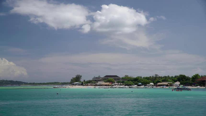 A body of water on a partly cloudy day