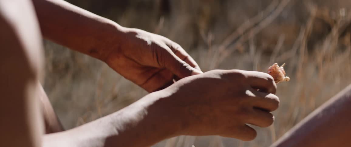 Indigenous hunters prepping hunting tools