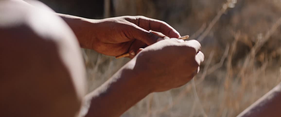 A person working on a tool outdoors
