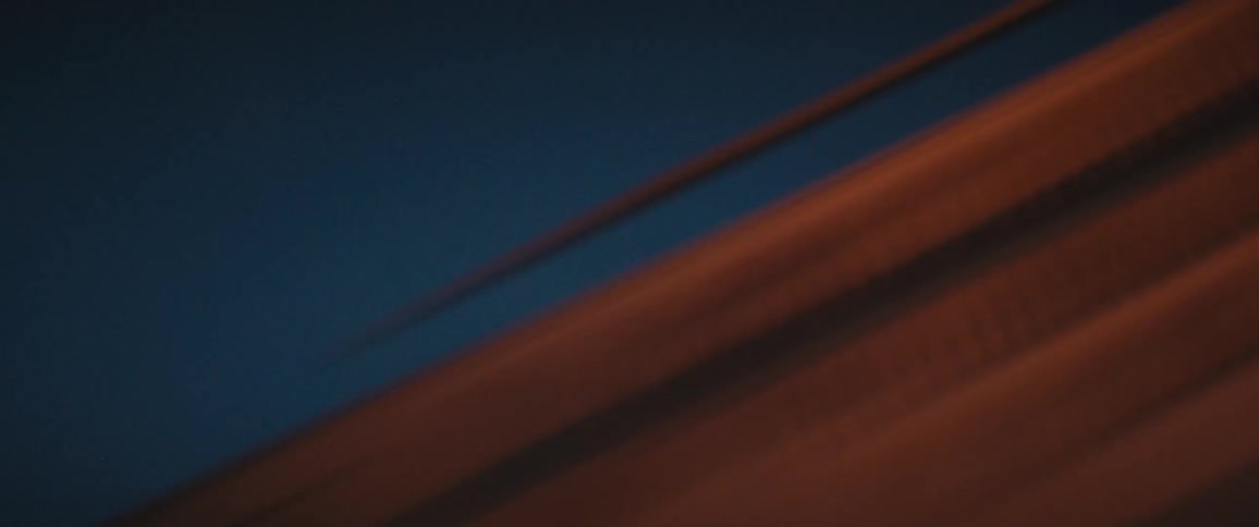 Traveling past walls and buildings and lights at night