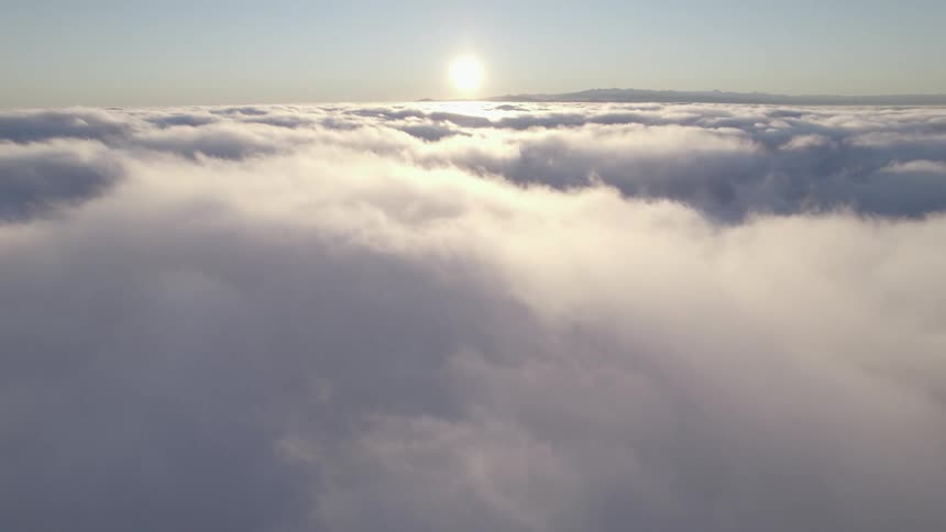 Aerial view of clouds covering the sky is displayed