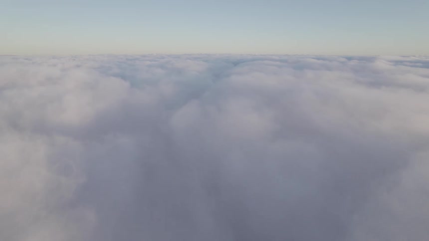 Aerial view flying above the clouds