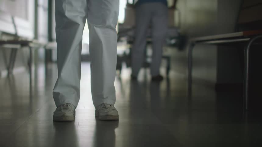 Hospital staff work in the hallway