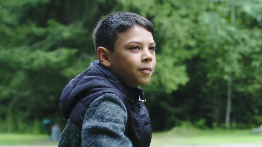 A boy is aiming his frisbee before he throws it and cheers