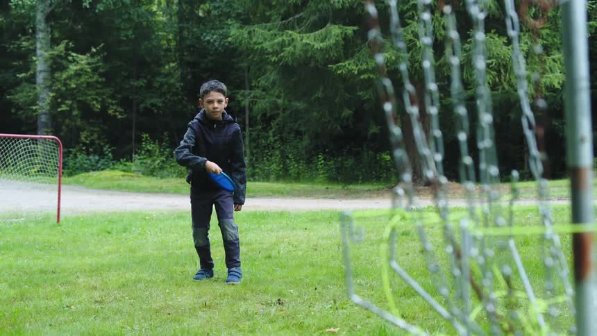 A child is playing outdoors in spring