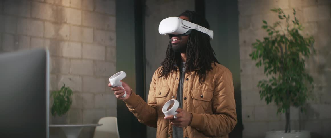 A man wearing a virtual reality headset indoors