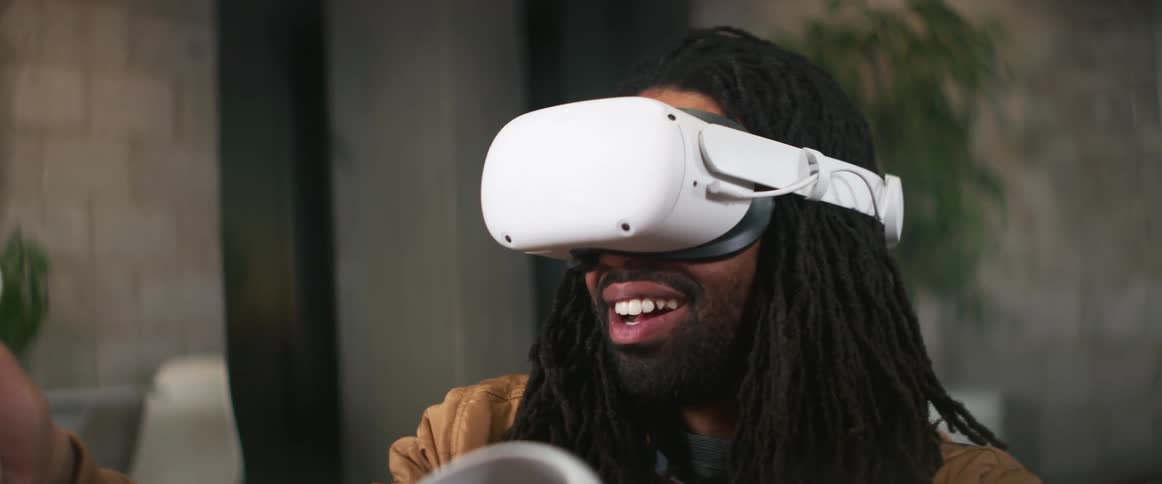 A man wearing virtual reality goggles