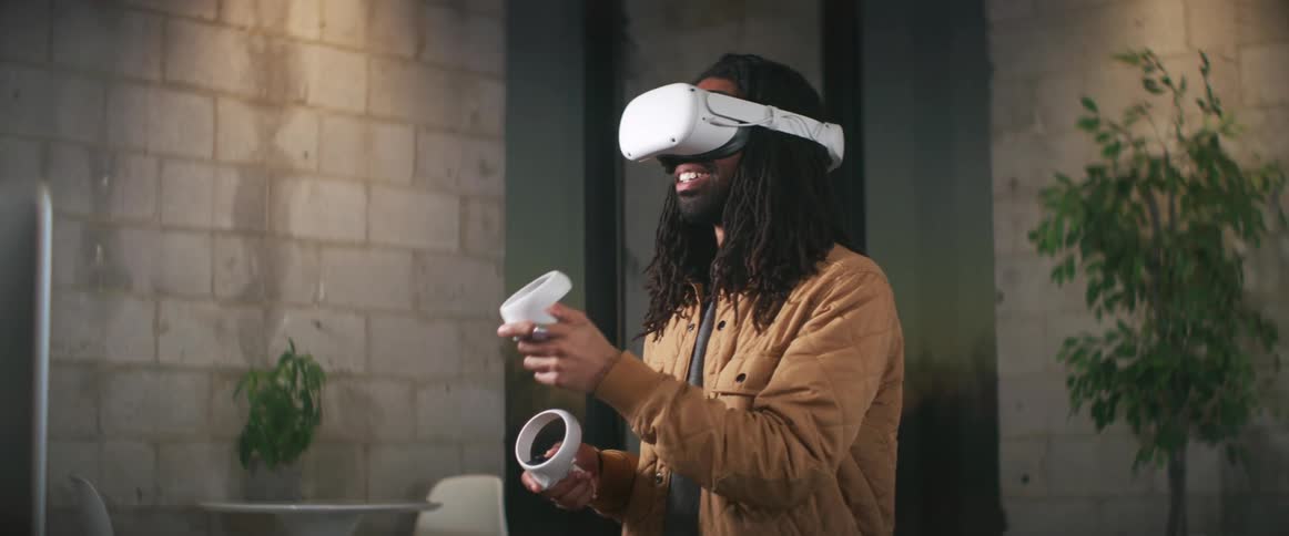 A man is playing virtual reality indoors