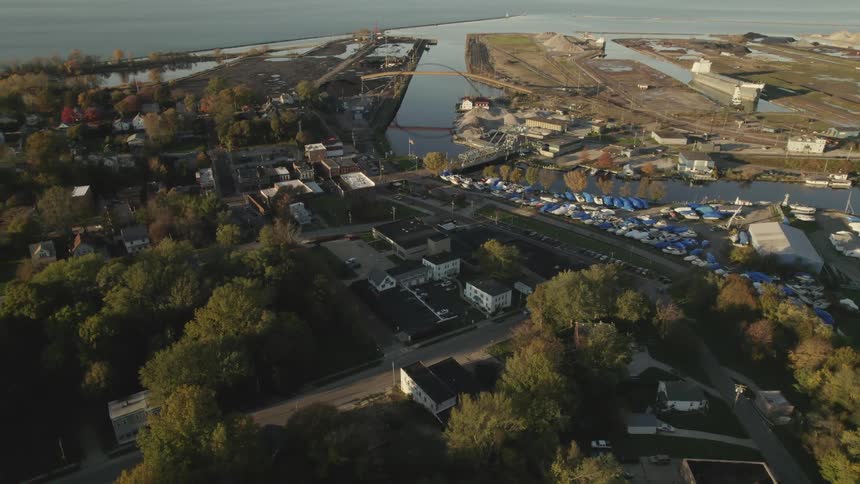Aerial view of buildings and cars in the neighborhood next to river