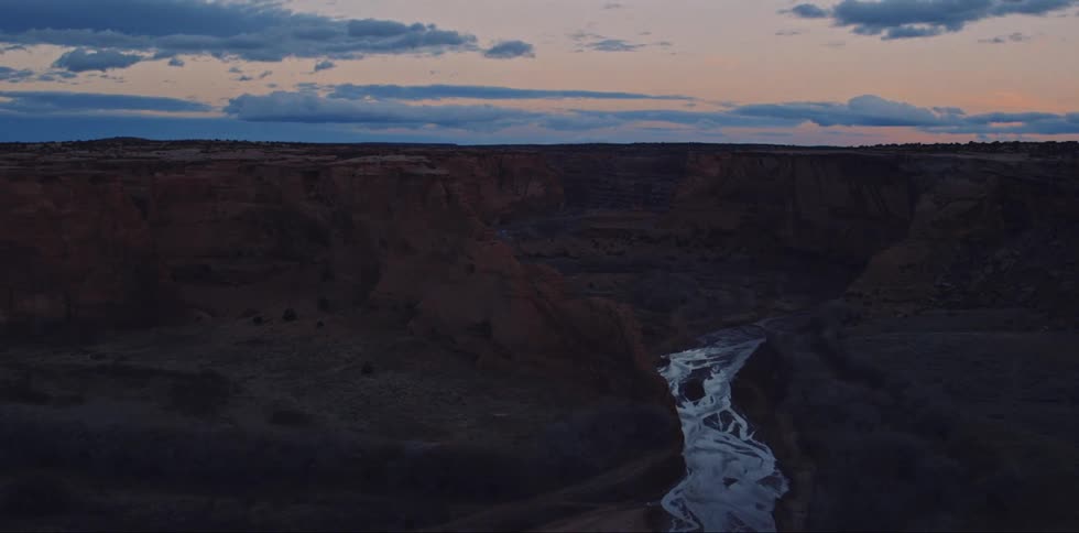 The water runs through the middle of the canyon