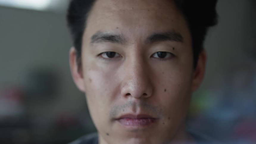 A close up view of a mans face is displayed