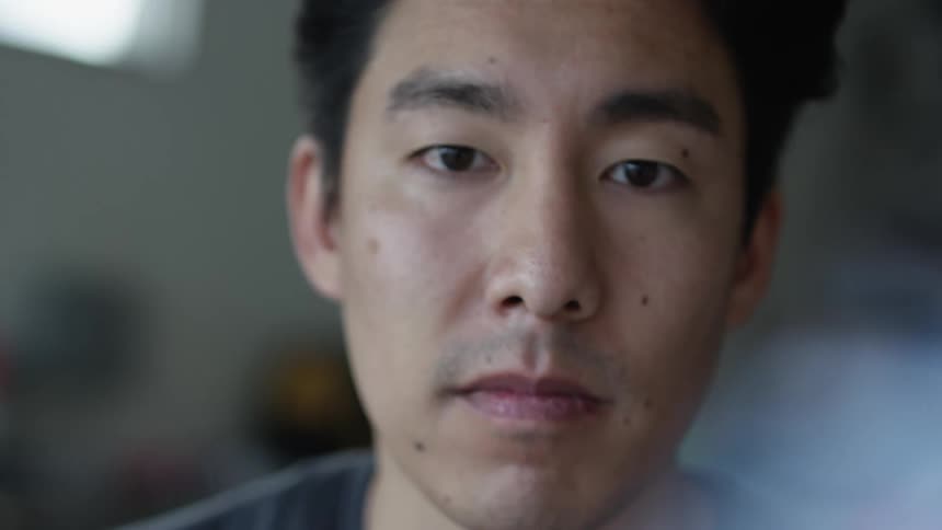 A portrait of an asian man